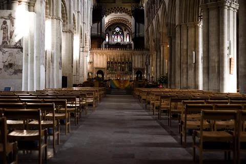 Cathedral interior from low angle with seating where church services take pla Stock Photos