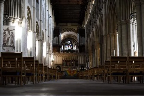 Cathedral interior from low angle with seating where church services take pla Stock Photos
