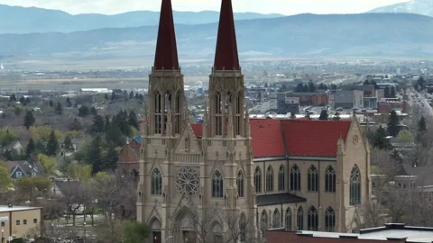 Cathedral of Saint Helena’s twin Gothic spires and rose window rise above Stock Footage 338030367