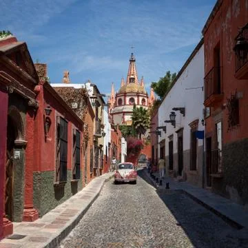 Cathedral of San Miguel de Allende in Mexico Behind Colorful Mexican Buildings Stock Photos