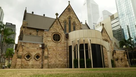 The Cathedral of St Stephen next to Brisbane skyscrapers 6K Stock Footage 329220238
