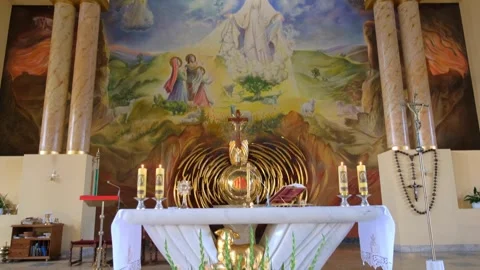 Catholic altar featuring mural with robed figures and sheep in Warsaw Video stock 342068237