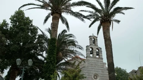 Catholic chapel surrounded by green trees on summer day. Stock Footage 77768449