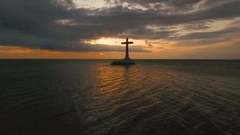 Catholic cross in the sea Stock Footage 72634875
