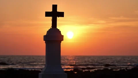 Catholic cross on the sunset shore Stock Footage 264085798