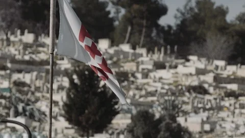 Catholic Crusaders Flag flying in Jerusalem on the Mount of Olives Stock Footage 86071847
