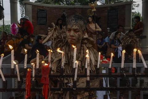 Catholic devotees mark the feast day of Saint John the Baptist with Mud People F Stock Photos