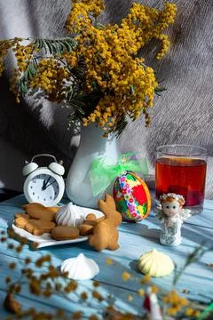 Catholic Easter celebration concept. Greeting card format. mimosa in a vase Stock Photos