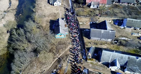 Catholics wear a cross in the city. Procession on Palm Sunday. Aerial Stock Footage 104588024
