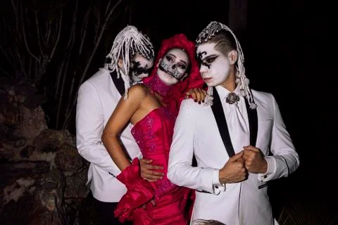 A catrina between two catrin at night Stock Photos