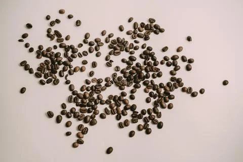 Cattered coffee beans on the table Stock Photos