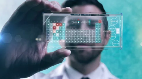 Caucasian American scientist using display technology showing periodic elements Stock Footage 54564182