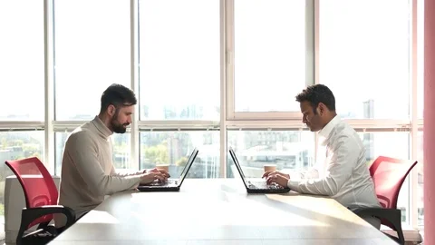 Caucasian and indian programmers working hard. Stock Footage 85449148