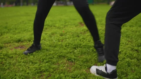 Caucasian athletes balancing during quick agility exercises in field Video stock 325031822