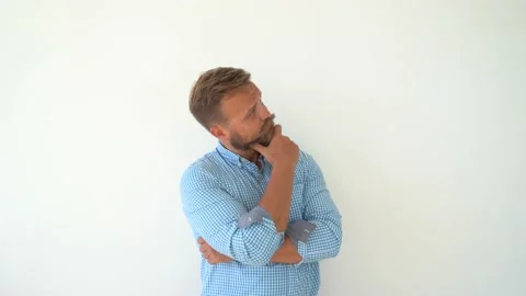 Caucasian bearded young man thinking, making decision Stock Footage 148072036