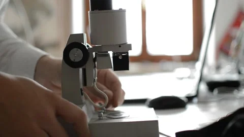 Caucasian biologist man use microscope in his laboratory Vidéo 168803578