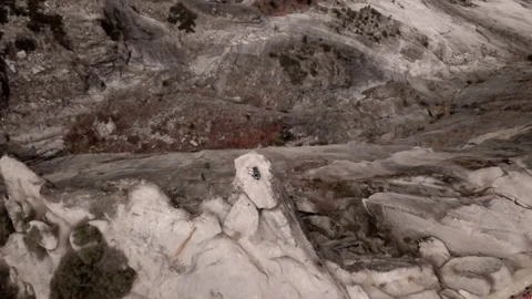 Caucasian boy with a backpack and a remote control in a mountain Stock Footage 223368475