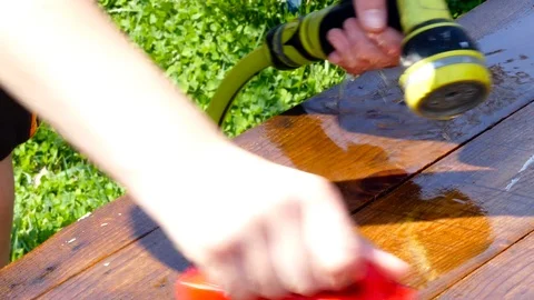 Caucasian boy cleaning pine table Stock Footage 88465152