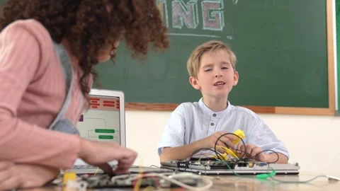 Caucasian boy fixing main board while looking at camera in stem class. Pedagogy. Stock Footage 281682075
