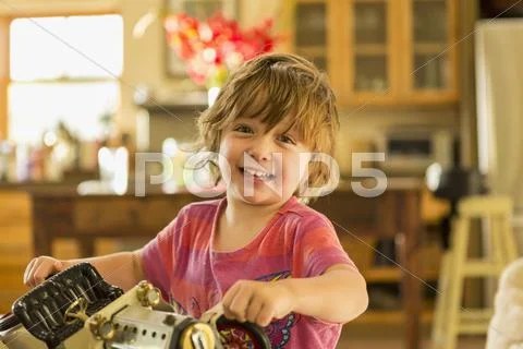 Caucasian boy holding vintage toy car Stock Photos