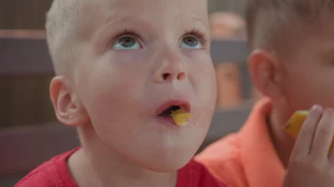 Caucasian Boy Making Messy Face After Melon Bite, Juice Dripping And Funny Stock Footage 327093361