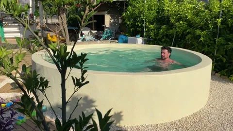 Caucasian boy relaxes in the pool Video stock 146875399