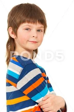 Caucasian boy standing with his arms folded Stock Photos
