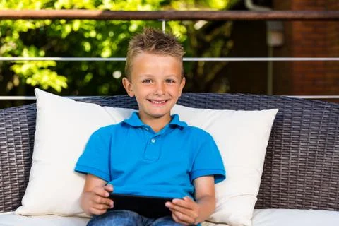 Caucasian boy with tablet Stock Photos