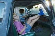 Caucasian Brother And Sister In Truck Stock Photos