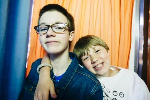 Caucasian brothers smiling in photo booth Stock Photos