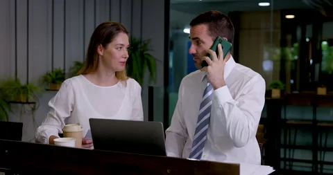 Caucasian business colleagues coordinate work in modern coworking office Stock Footage 345030652