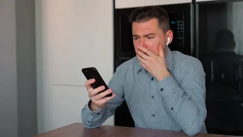 Caucasian business man developer receiving bad news on smartphone indoors Stock Footage 153977536