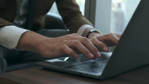 Caucasian business man's hands using laptop keyboard at modern office. Stock Footage 243297436