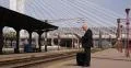 Caucasian Business Person Read Newspaper Daily Edition Wait Arriving Late Train 4k or 4k+ Resolution