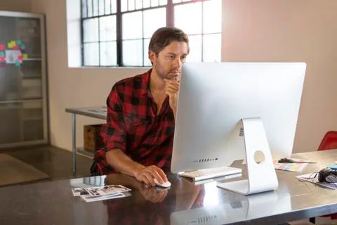 Caucasian businessman using computer in office Stock Photos