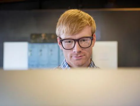 Caucasian businessman working on computer Stock Photos
