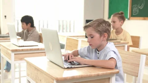 Caucasian child programing software system and learning about coding. Pedagogy. Stock Footage 270086407