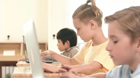 Caucasian child programing software system and learning about coding. Pedagogy. Stock Footage 270431775