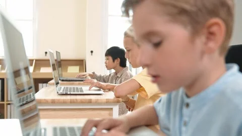 Caucasian child programing software system and learning about coding. Pedagogy. Stock Footage 272888493