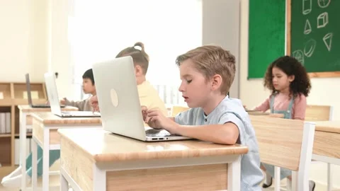 Caucasian child programing software system and learning about coding. Pedagogy. Stock Footage 278372139