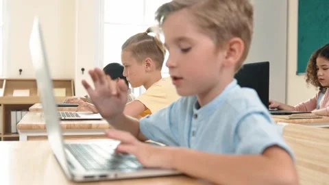 Caucasian child programing software system and learning about coding. Pedagogy. Stock Footage 280362488
