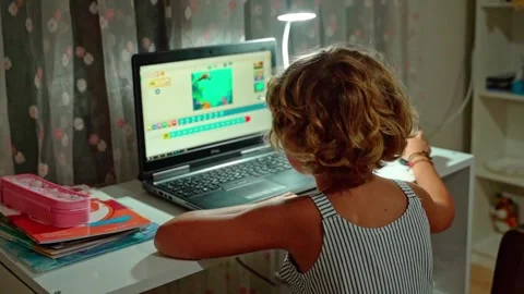 Caucasian child school boy or girl studying at home using laptop remote Stock Footage 247621664