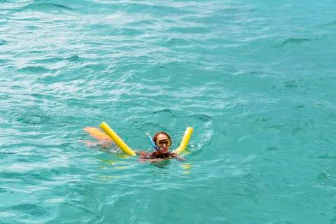 Caucasian Child Snorkelling Using A Floatation Noodle Foto stock