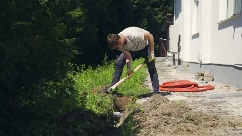 Caucasian construction worker drill with pick, wide angle static shot. Stock Footage 133611566