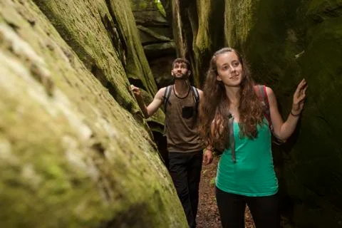 Caucasian couple exploring cave Fotos Stock