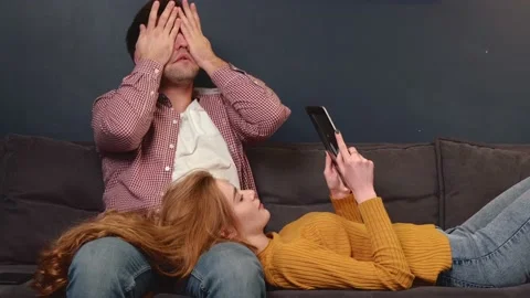 Caucasian couple falling asleep while sitting on the couch and using a tablet 스톡 동영상 150139057