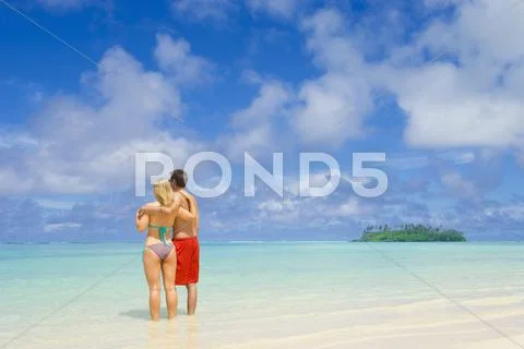 Caucasian Couple Hugging On Tropical Beach