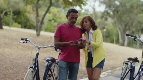 Caucasian couple looking at mobile screen and gesticulating 動画素材 159758366