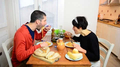 Caucasian couple talking while eats traditional italian food 스톡 동영상 122297325