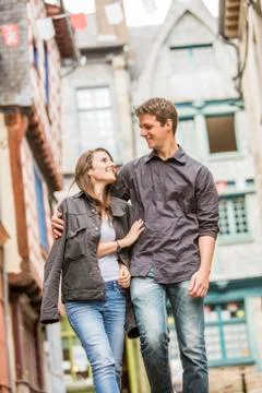 Caucasian couple walking in village Fotos de archivo